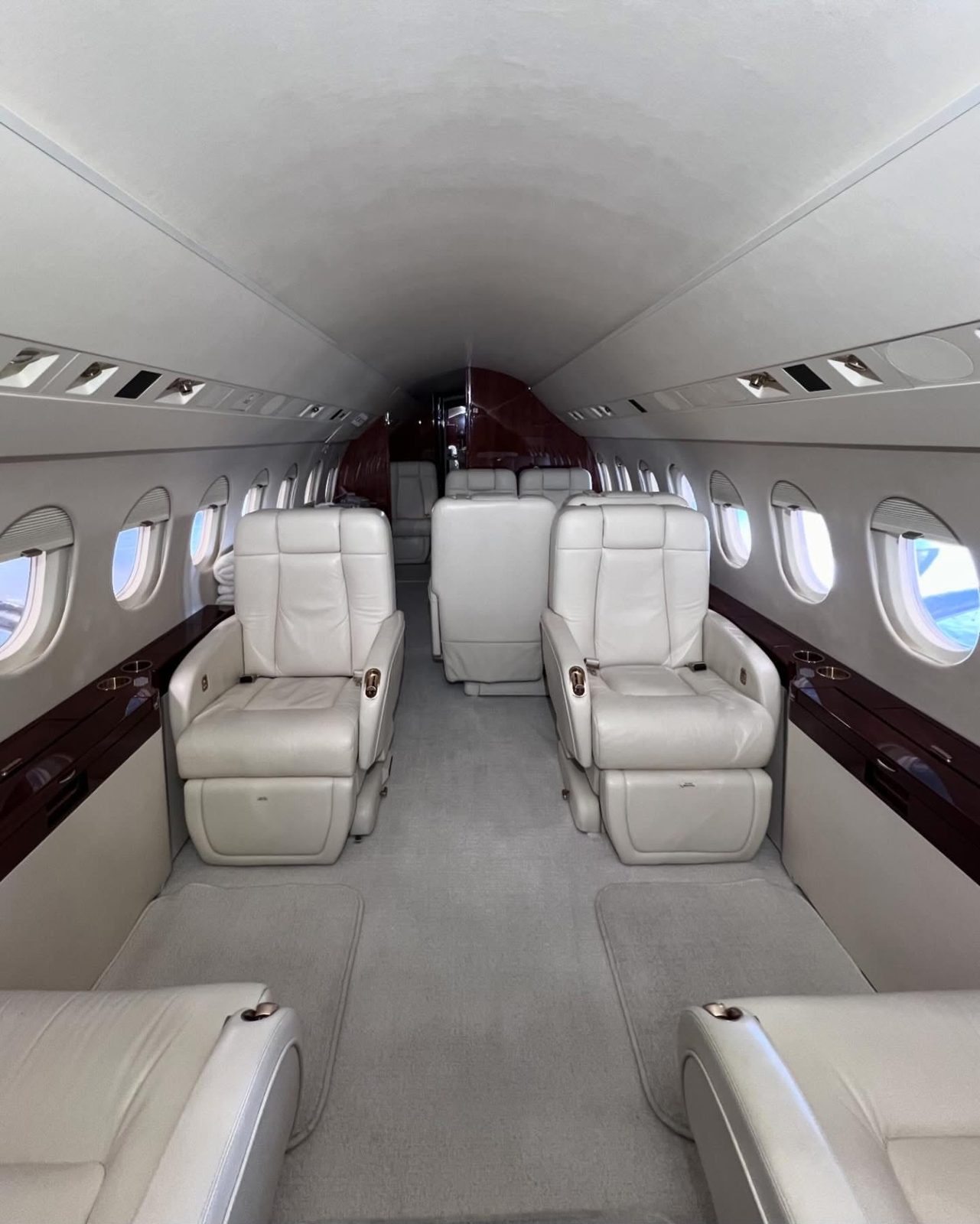 Clean leather seats in a private jet cabin after interior detailing